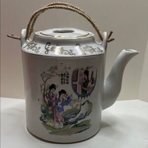 Elegant Porcelain Teapot with Asian Art Design